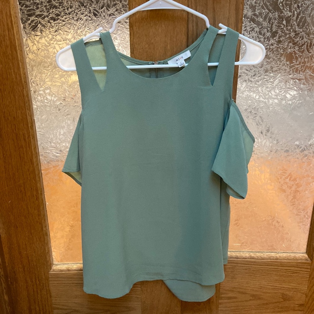 Light green blouse with cut out sleeve detail